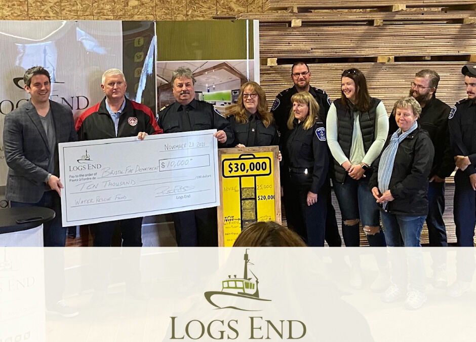 Cheque presentation at Logs End mill with Bristol Fire Department members